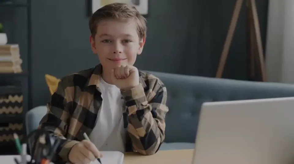 A young learner taking an online Spanish lesson